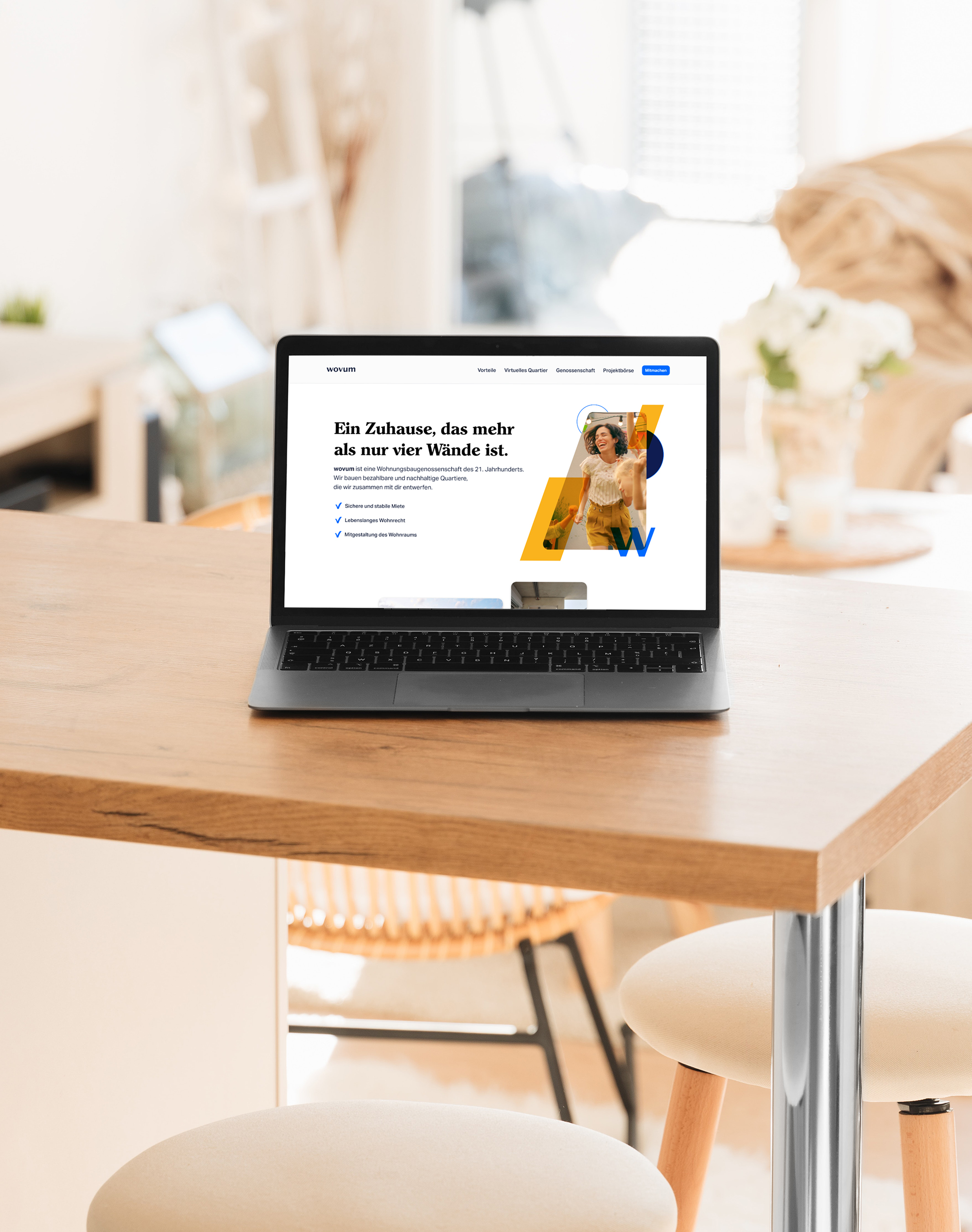 The image shows a laptop mockup showcasing the title page of the wovum landing page design.